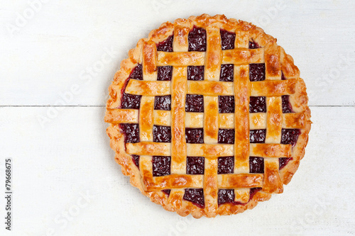 Raspberry pie with fresh raspberries on white background photo