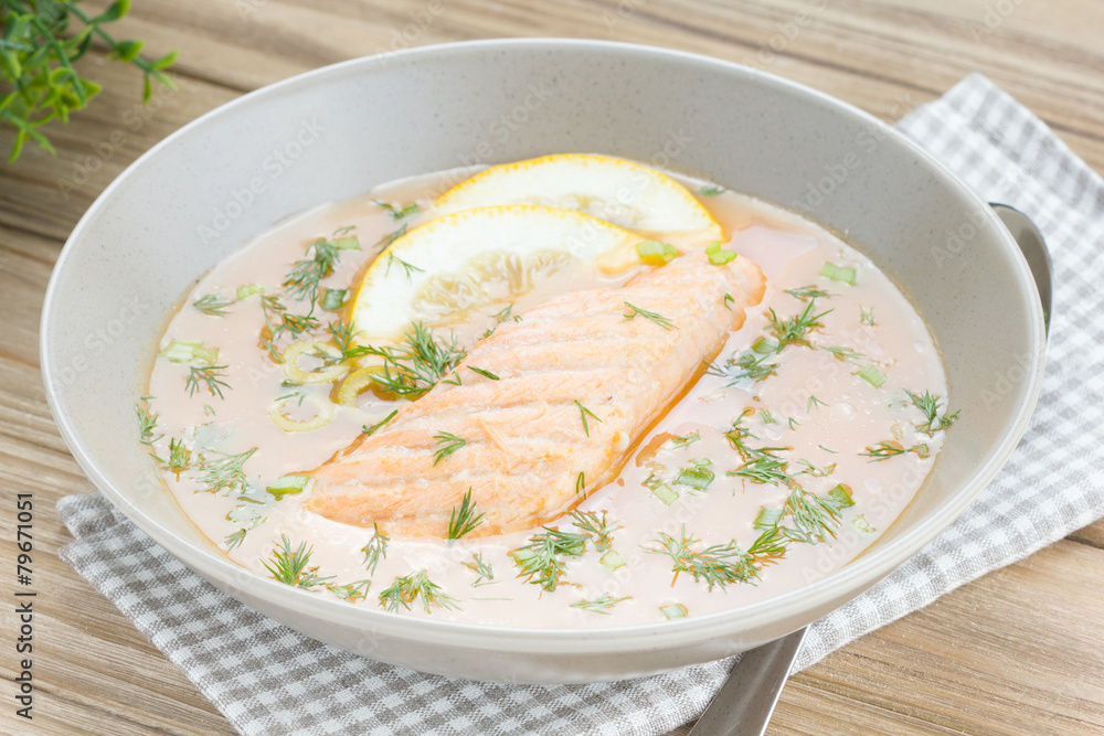 Salmon soup on wooden desk background Salmon soup on wooden desk background