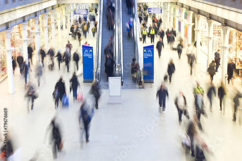 London Train Tube station Blur people movement in rush hour, at photo