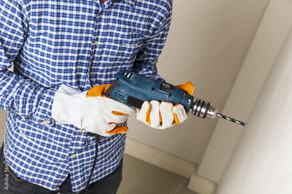 Man holding drilling tools