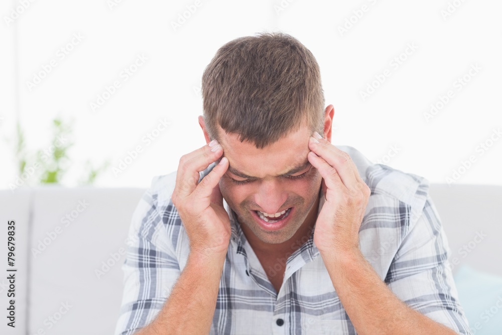 Man suffering from headache Man suffering from headache