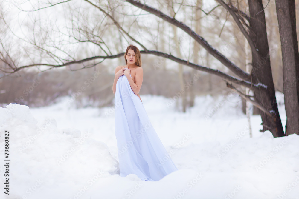 Naked girl in winter forest. Naked girl in winter forest.