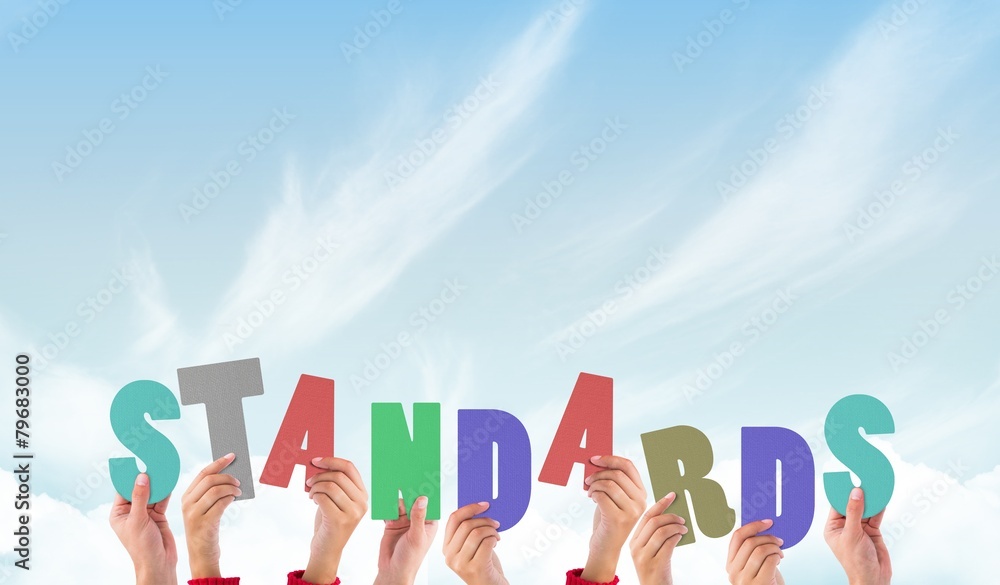 Obraz premium Composite image of hands holding up standards