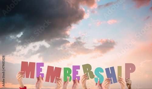 Composite image of hands holding up membership photo