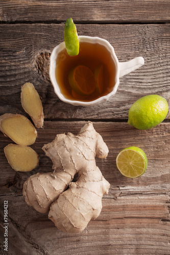 Fototapeta Naklejka Na Ścianę i Meble -  Ginger tea with lime in a white cup