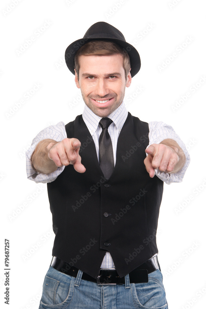 Smiling stylish caucasian man pointing his fingers at the cameta Smiling stylish caucasian man pointing his fingers at the cameta