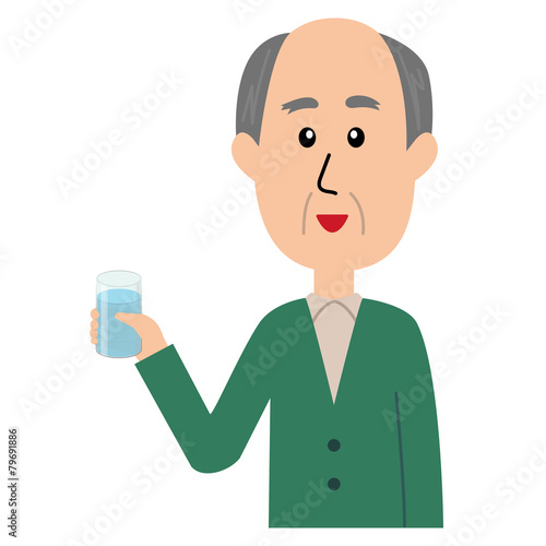 A happy elderly man with a glass of water in his hand