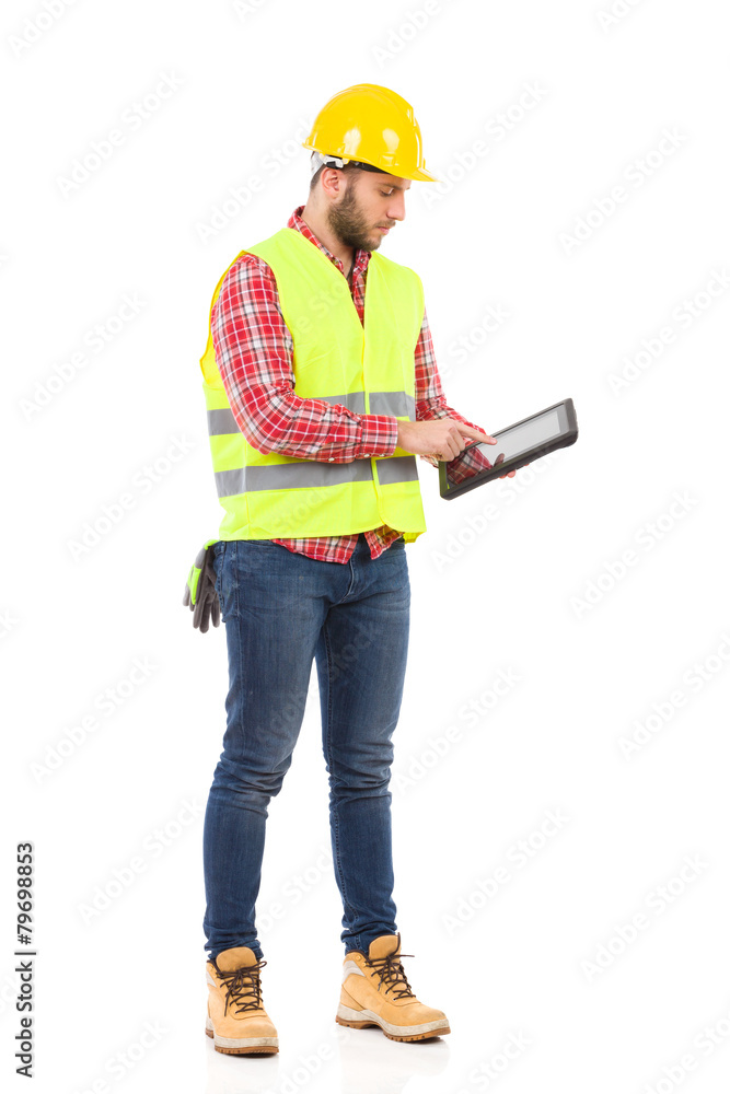 Focused worker using a digital tablet Focused worker using a digital tablet
