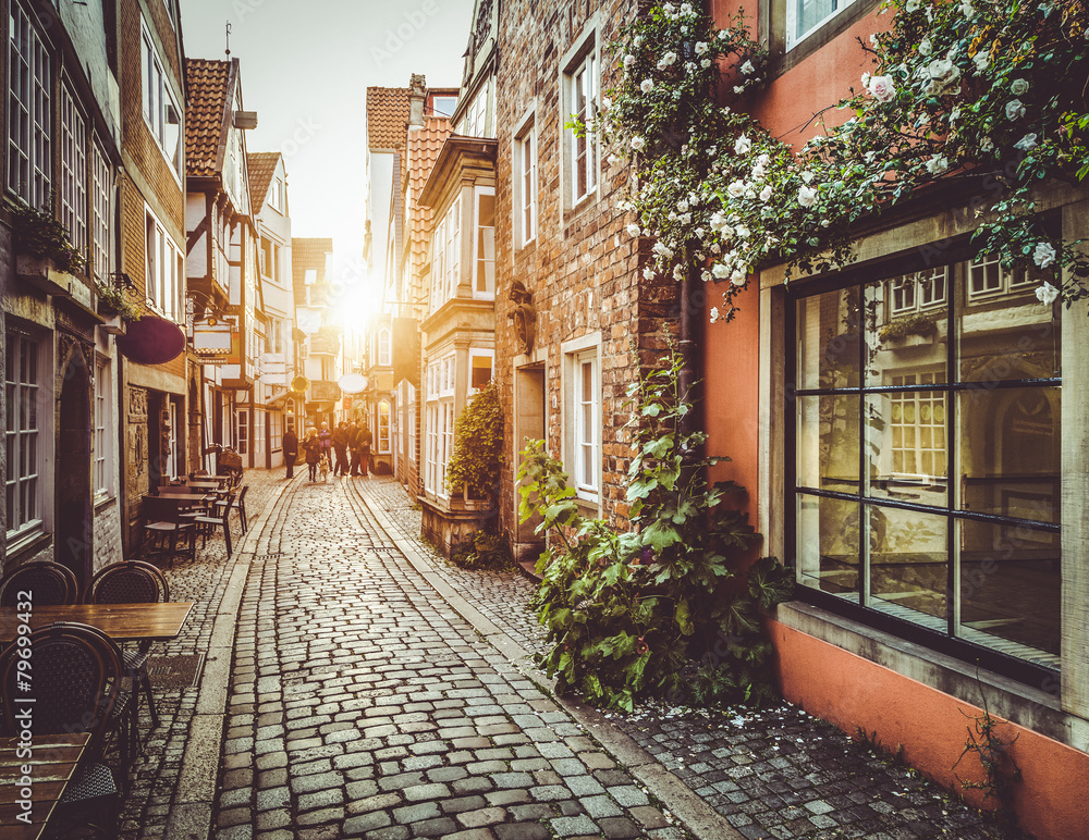 Old town in Europe at sunset with retro vintage filter effect