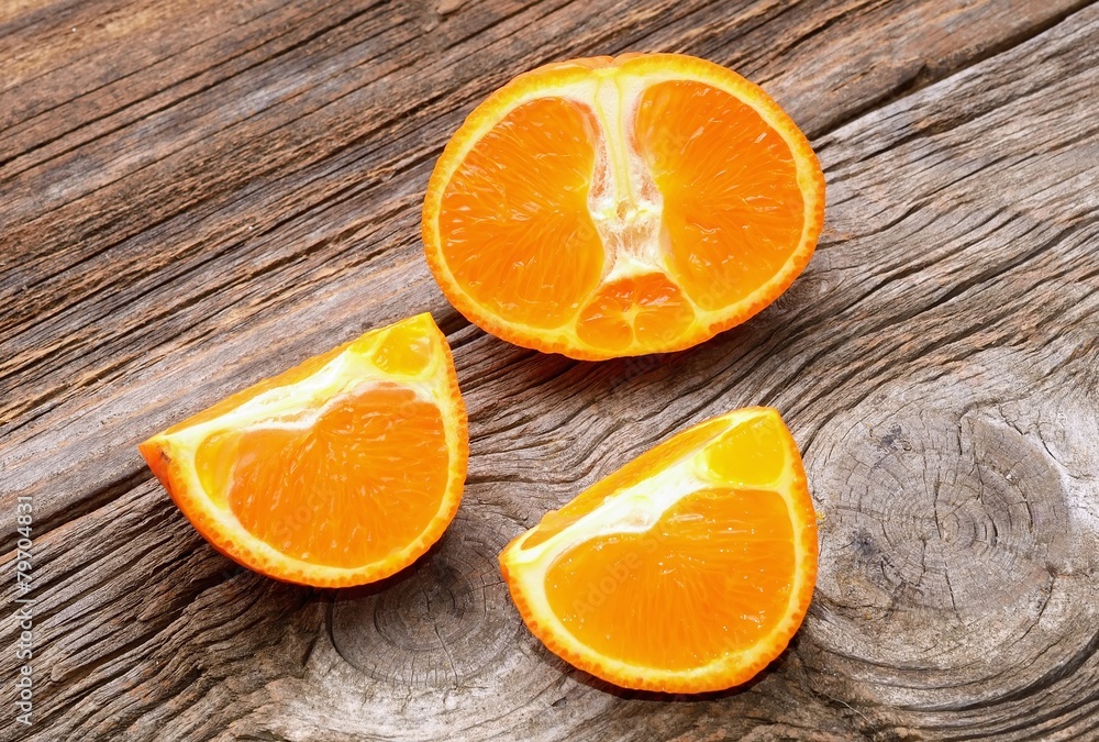 Ripe tangerines on wooden background Ripe tangerines on wooden background