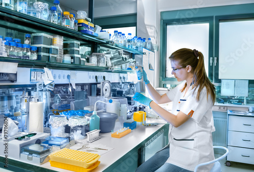 Young scientist works in modern laboratory photo