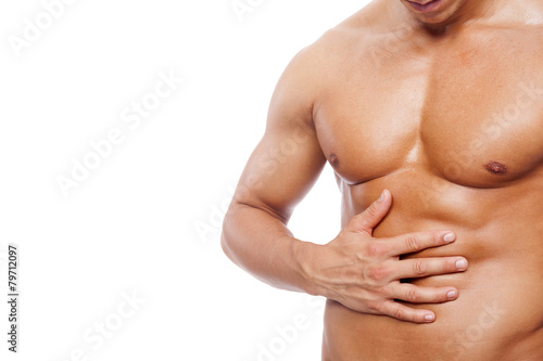 Muscle man with stomach pain  isolated on white backg
