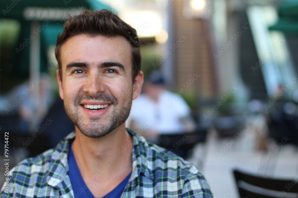 Portrait of a handsome man smiling outside Portrait of a handsome man smiling outside
