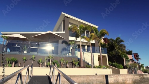 Panning shot of luxury waterfront home