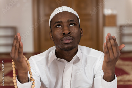 African Muslim Man Is Praying In The Mosque