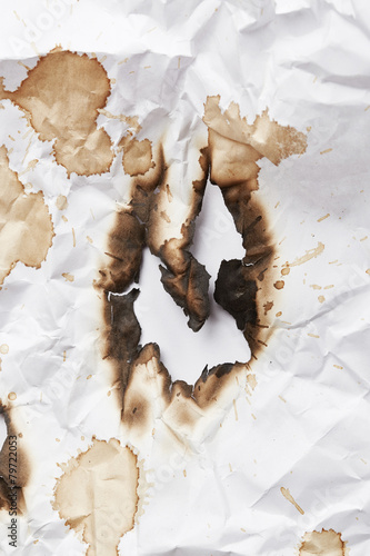 Fototapeta Naklejka Na Ścianę i Meble -  Burnt hole of paper