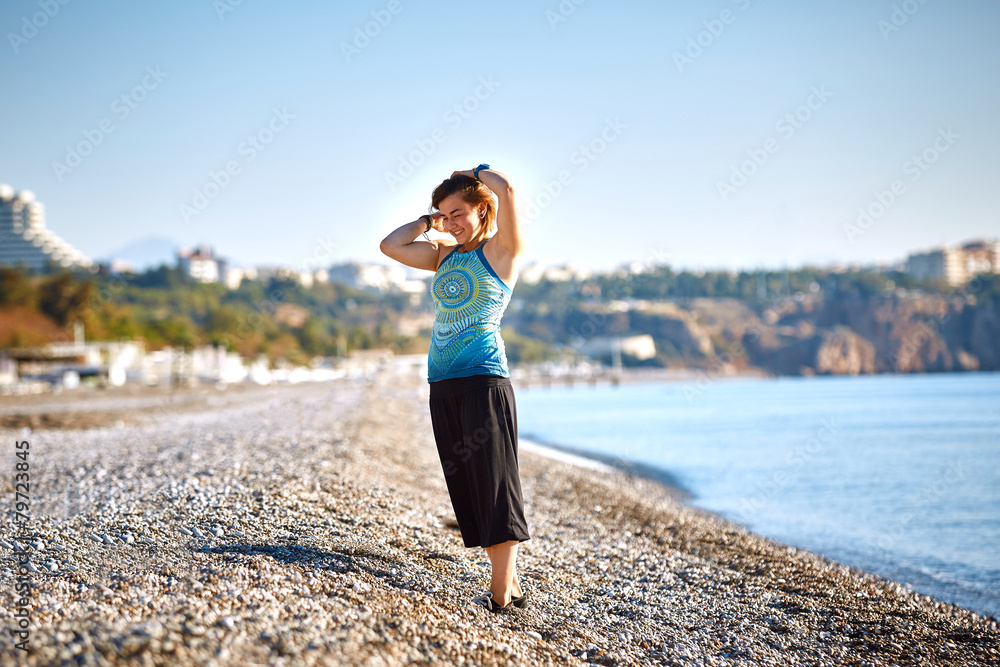 girl plays on the sea beach