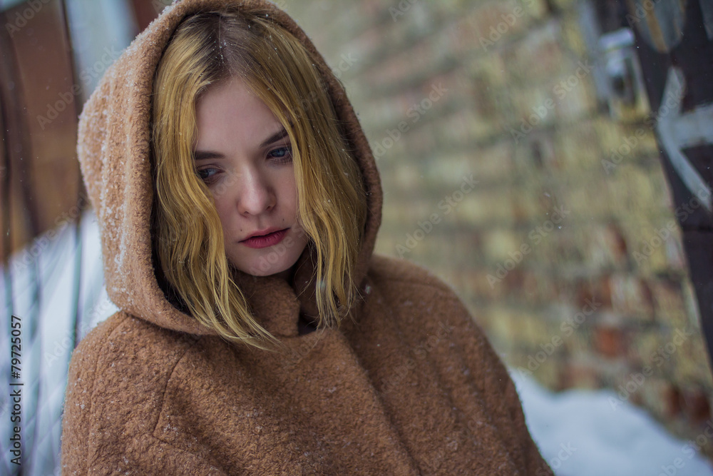 the girl in the coat on the street