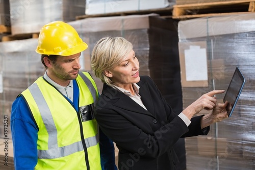 Warehouse worker and manager using tablet pc