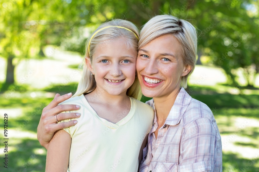 Pretty blonde with her daughter in the park