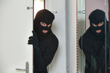 burglar thief at house breaking