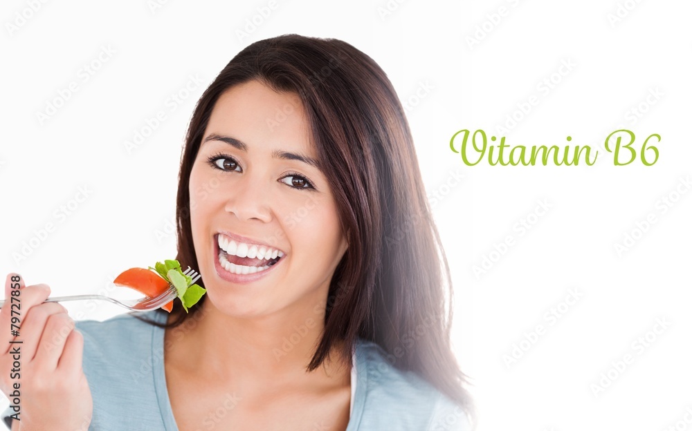 Vitamin b6 against good looking woman eating salad Vitamin b6 against good looking woman eating salad