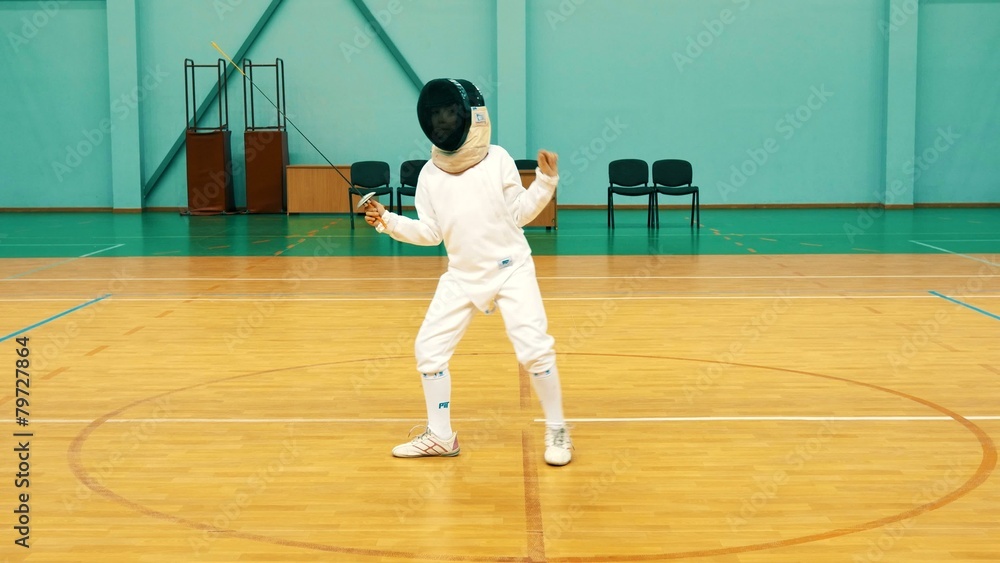 Little girl on a fencing training Little girl on a fencing training