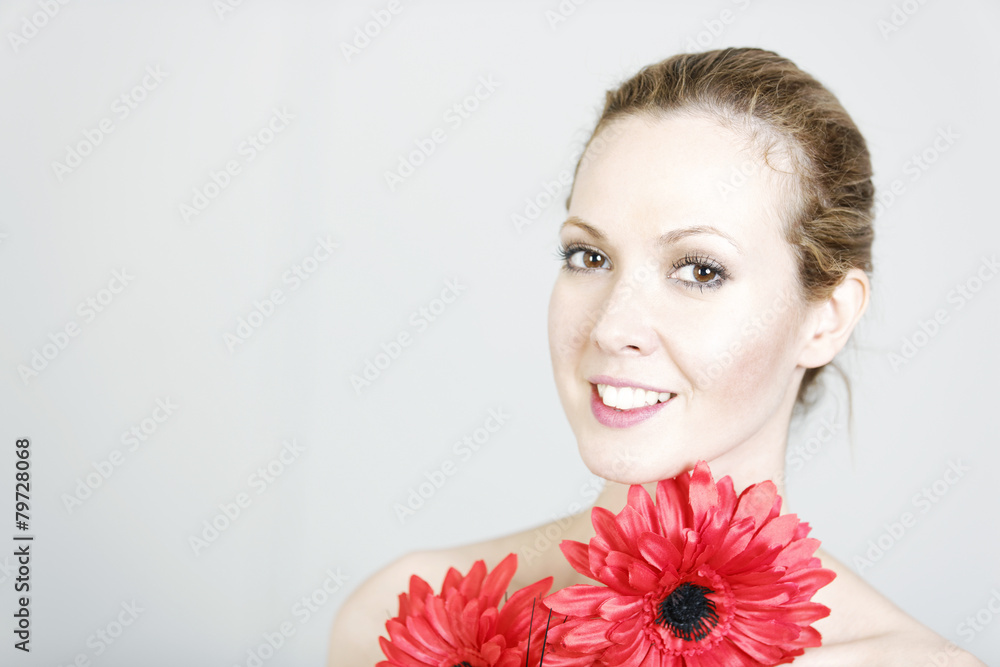 Woman holding red flowers Woman holding red flowers