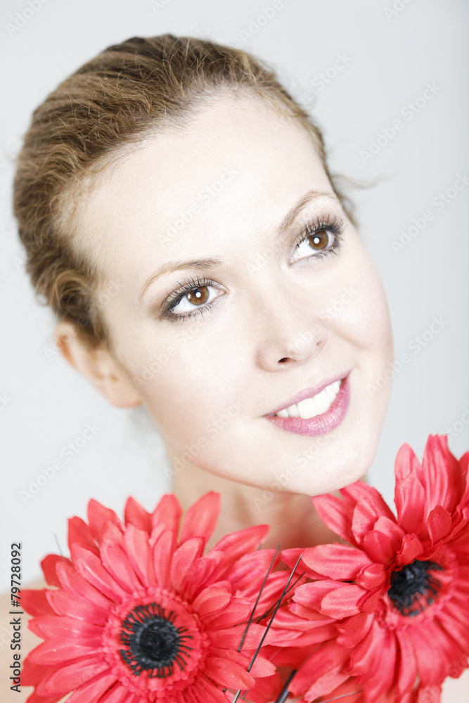 Woman holding red flowers Woman holding red flowers