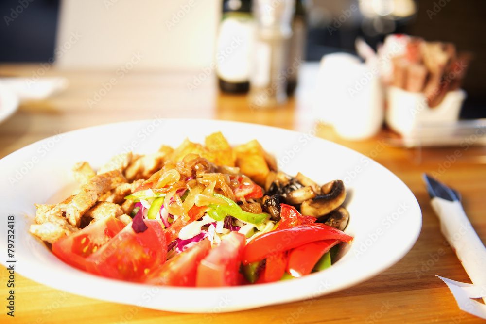 Salad with tomatoes, cheese, and vegetables Salad with tomatoes, cheese, and vegetables