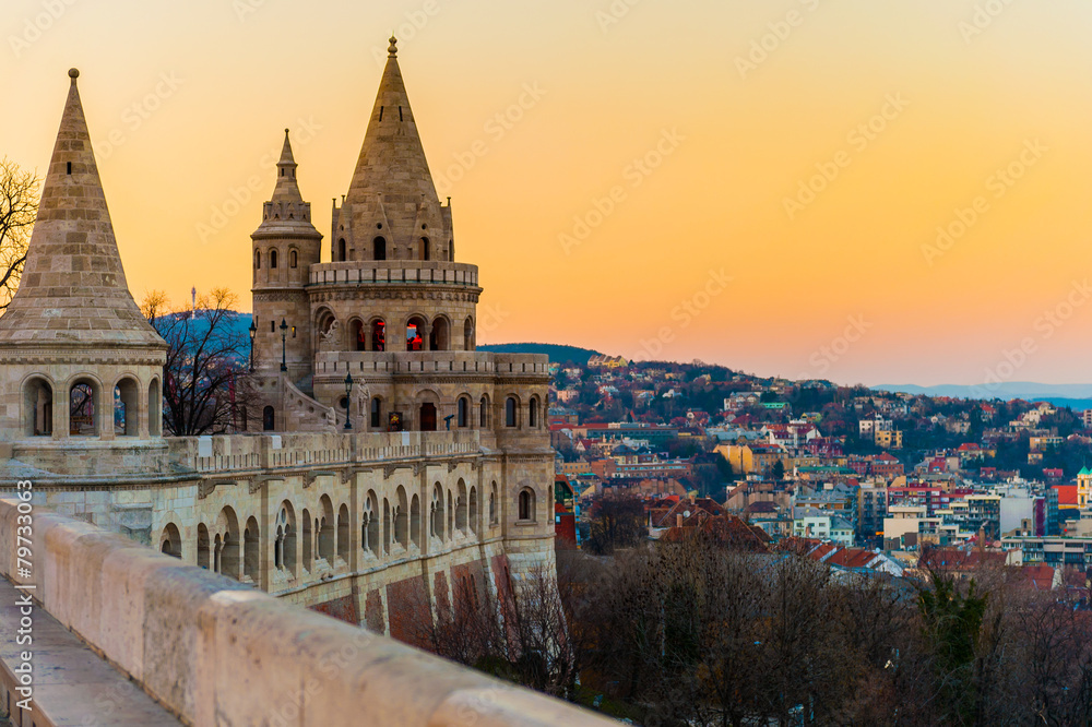 Buda castle with The Fisherman's Bastion over the city at sunset