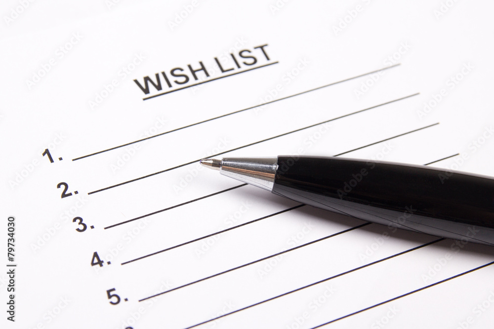 close up of blank wish list and pen close up of blank wish list and pen