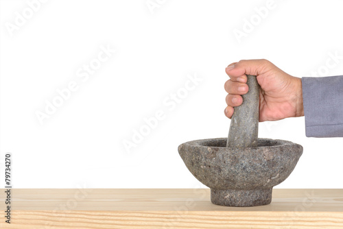 Fotografia hand business man catch pestle mortar on pine isolated on white