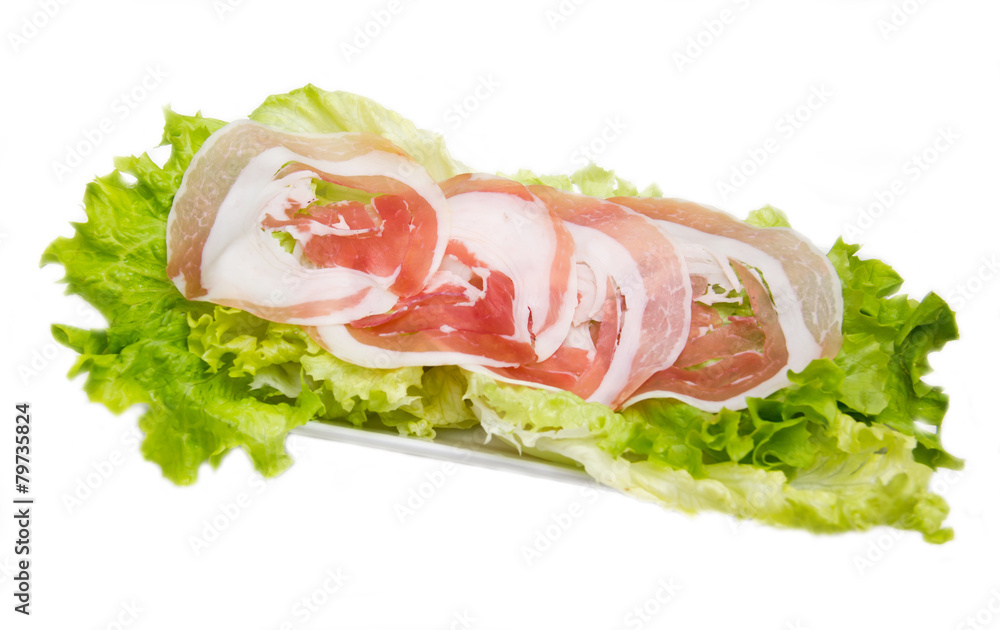 Rolled bacon on salad on white background