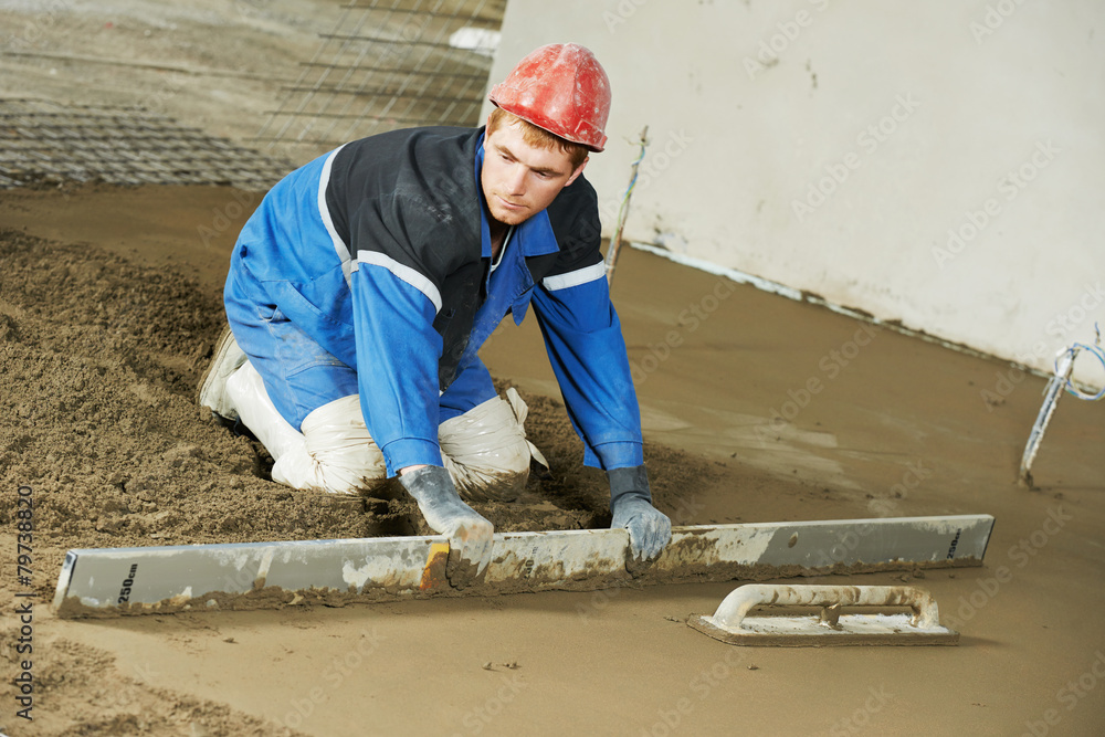 Plasterer concrete worker at floor work Plasterer concrete worker at floor work