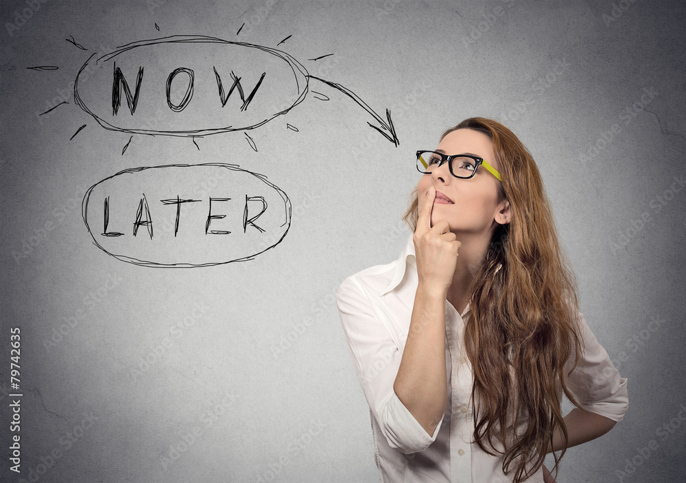 Now or later. Woman thinking looking up. Human face expression Now or later. Woman thinking looking up. Human face expression