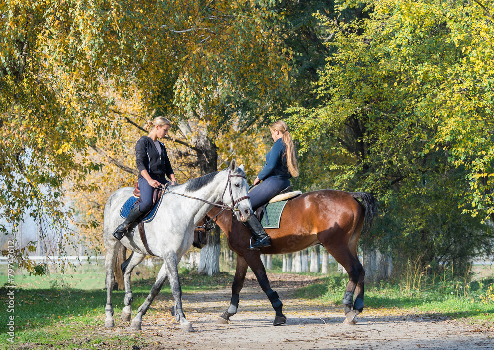 Girls  riding a horse