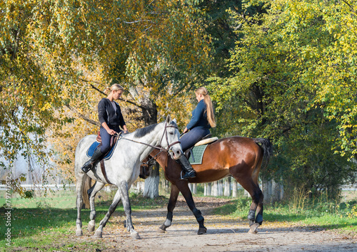 Girls  riding a horse © Dusan Kostic