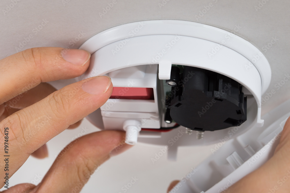 Handyman Repairing Smoke Detector Handyman Repairing Smoke Detector