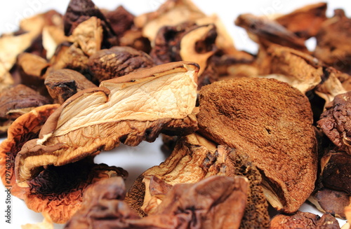 Heap of dried mushrooms on white background