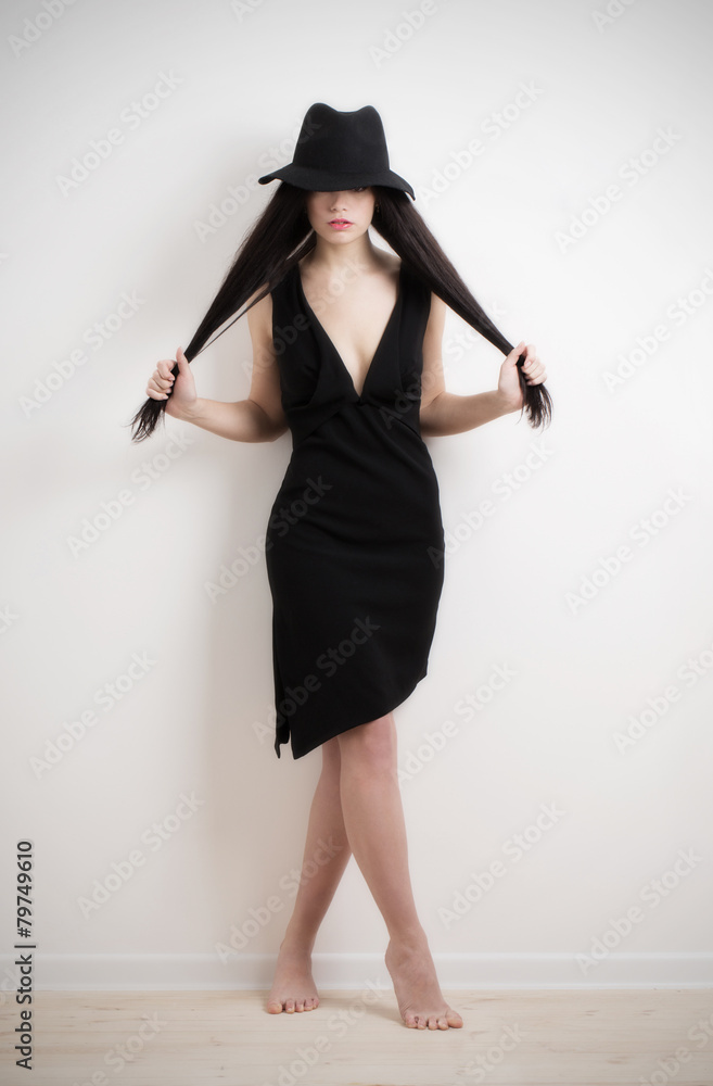 Young and beautiful woman in hat indoor Young and beautiful woman in hat indoor