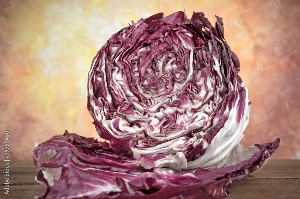 Obraz premium Round chicory radicchio on wooden table