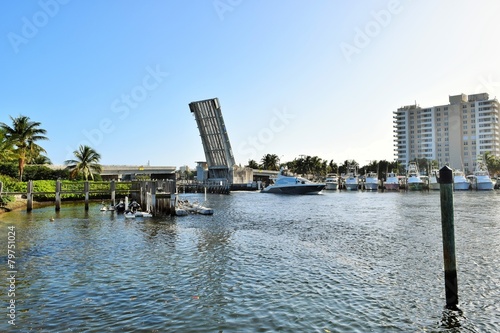 Open bridge above Florida Intracoastal waterway with boat photo