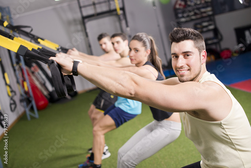 Group of people training elastic rope