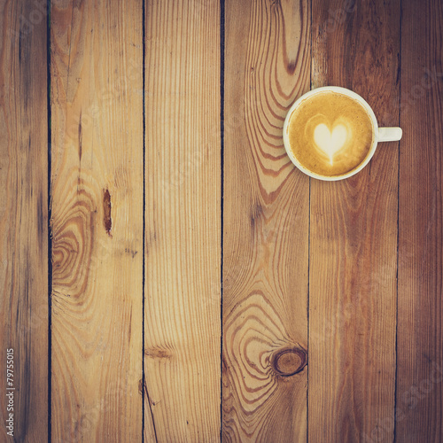 Latte coffee on wood background and texture with space