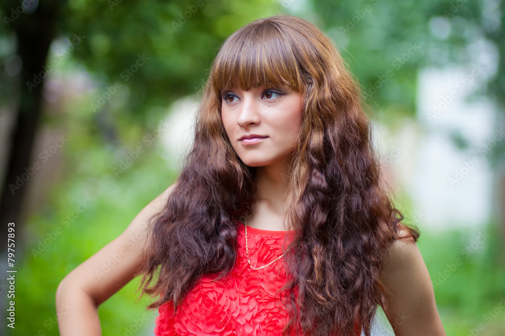 Closeup portrait of a beautiful girl in a red dress Closeup portrait of a beautiful girl in a red dress