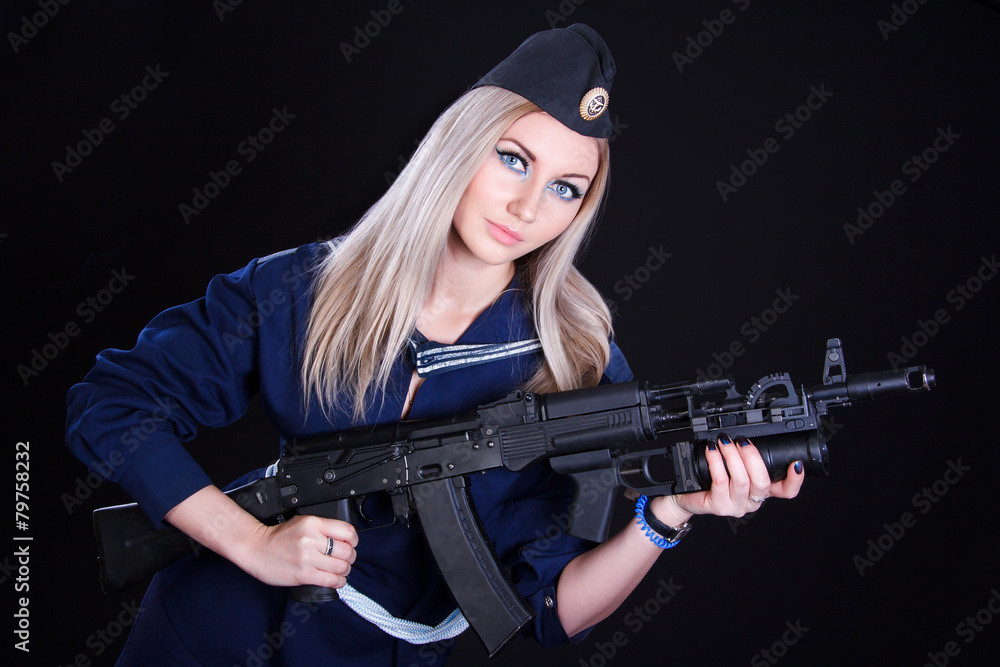 Woman in the marine uniform with an assault rifle Woman in the marine uniform with an assault rifle