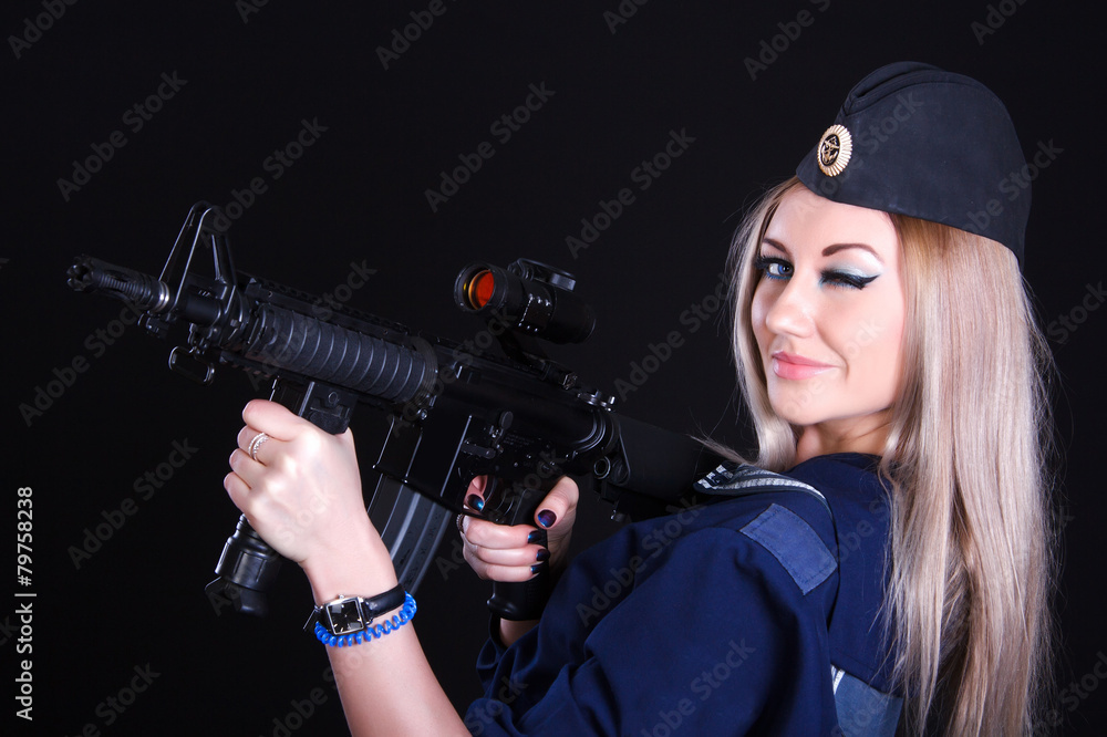 Woman in the marine uniform with an assault rifle Woman in the marine uniform with an assault rifle