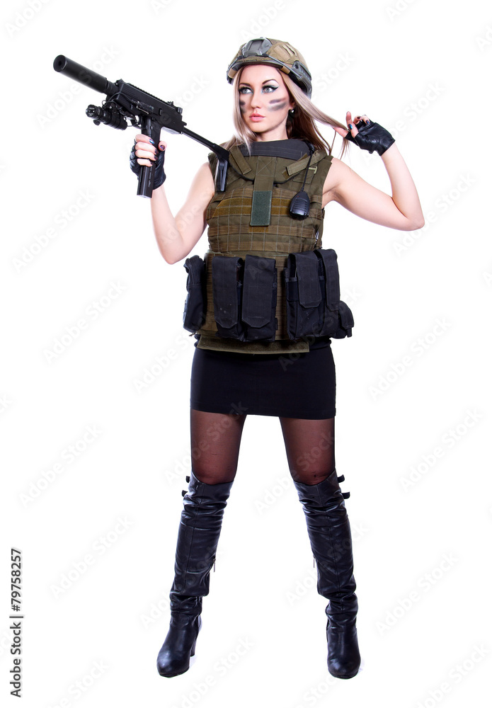 Woman in a military camouflage holding the smg Woman in a military camouflage holding the smg