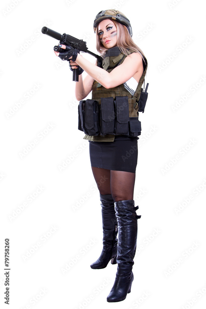 Woman in a military camouflage holding the smg Woman in a military camouflage holding the smg